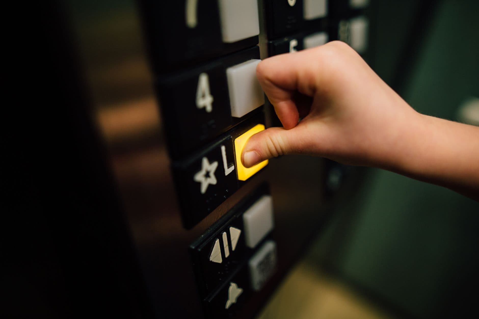 Technician working on elevator hoist machine during a modernization project