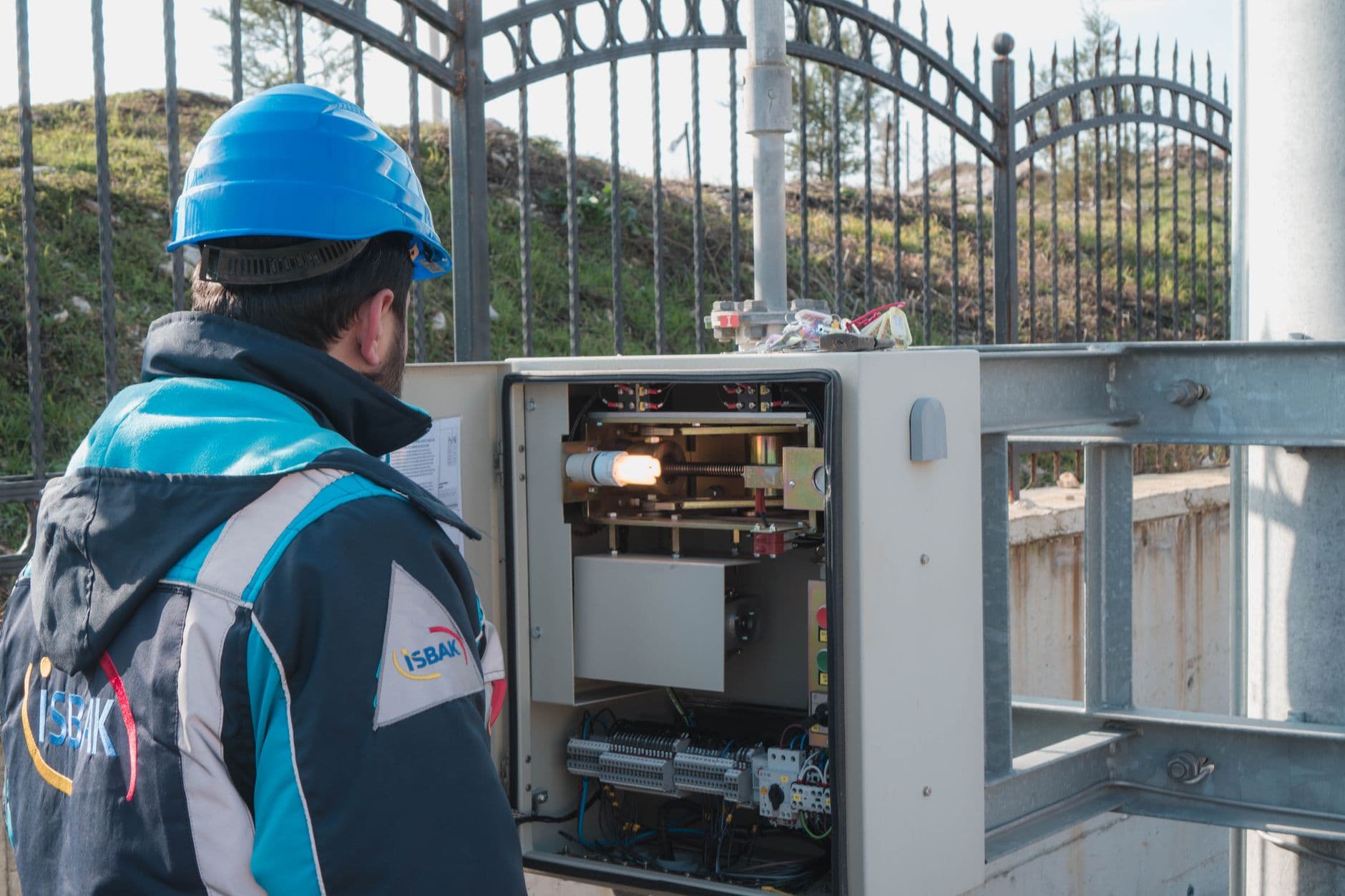 Elevator technician inspecting a controller panel during a repair diagnosis